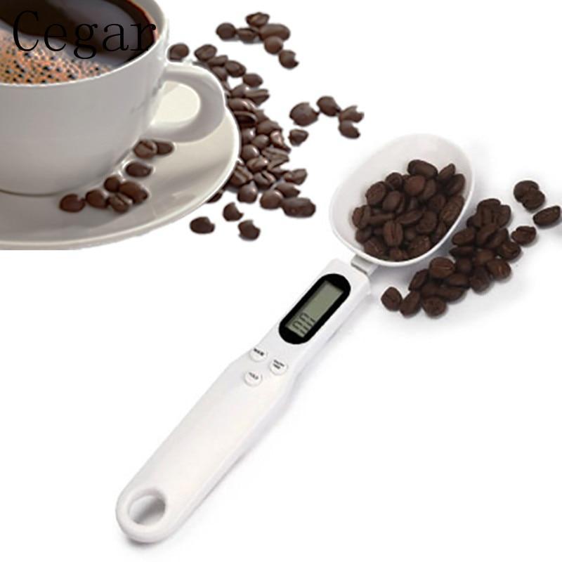 Cuillère balance numérique portable KitZenShop™ avec écran LCD, idéale pour mesurer farine, épices et ingrédients de cuisine.